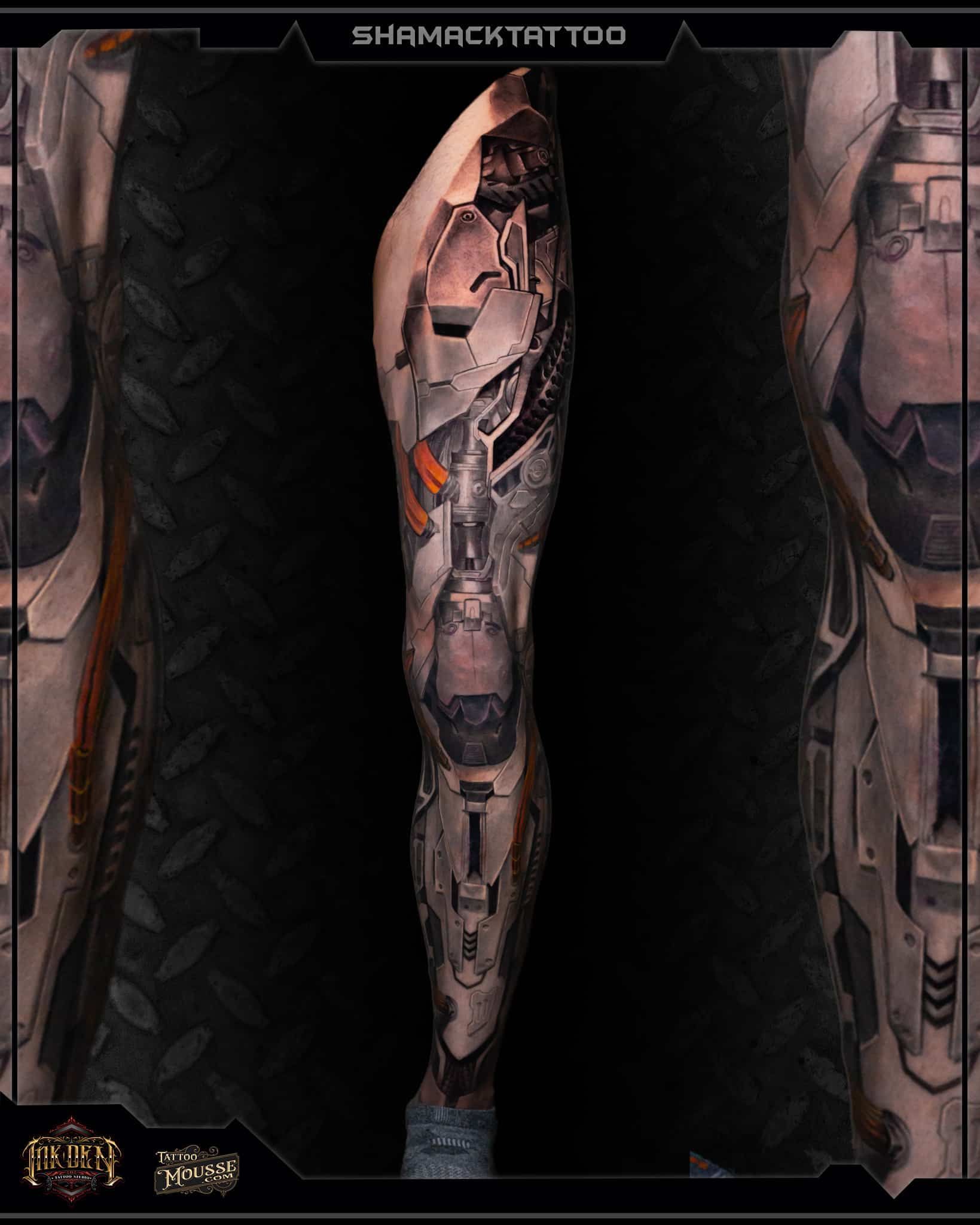Armored humanoid leg with metallic cybernetic tattoos, centered in a dark game-style frame.
