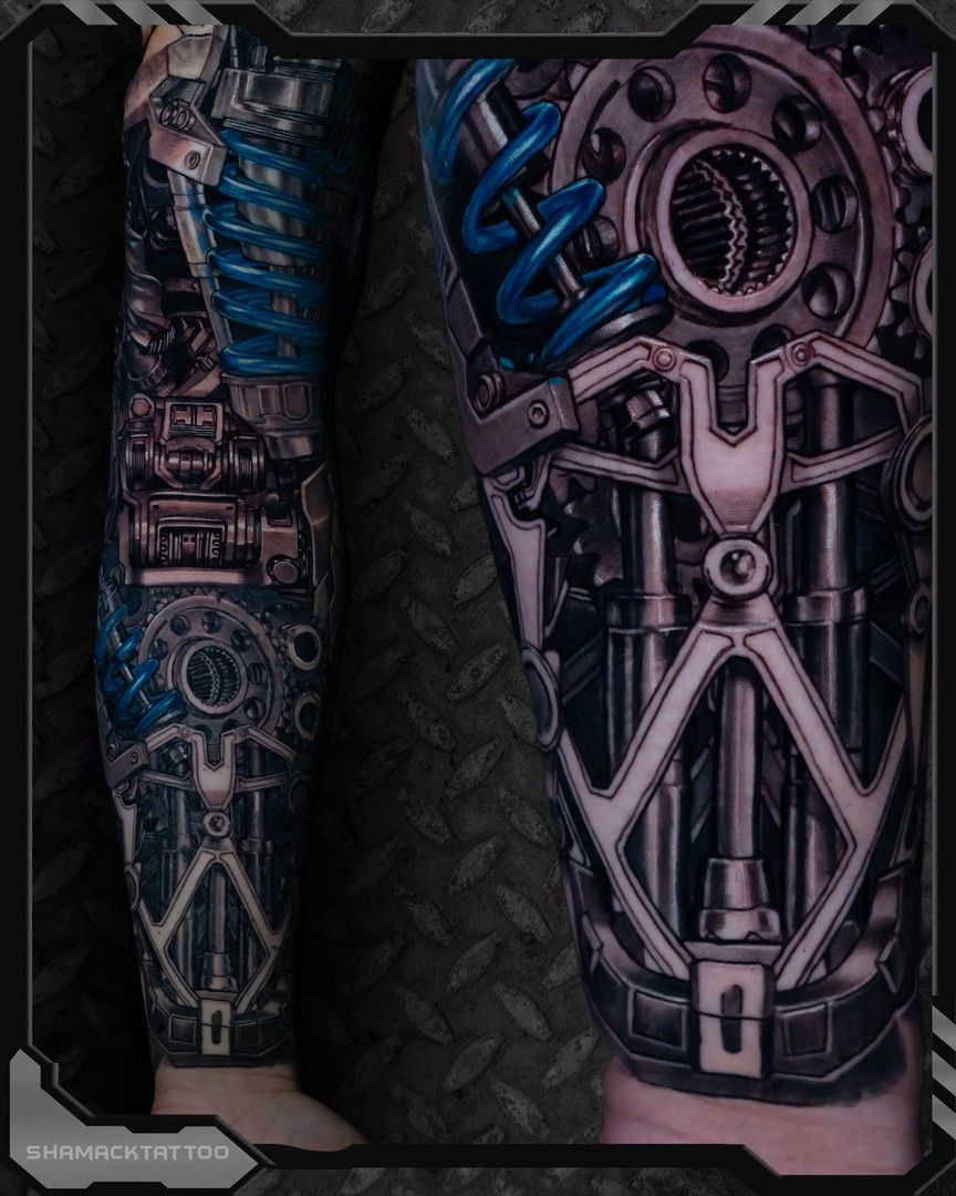 Blue and gray biomechanical tattoos on two forearms with intricate mechanical gears and circuits
