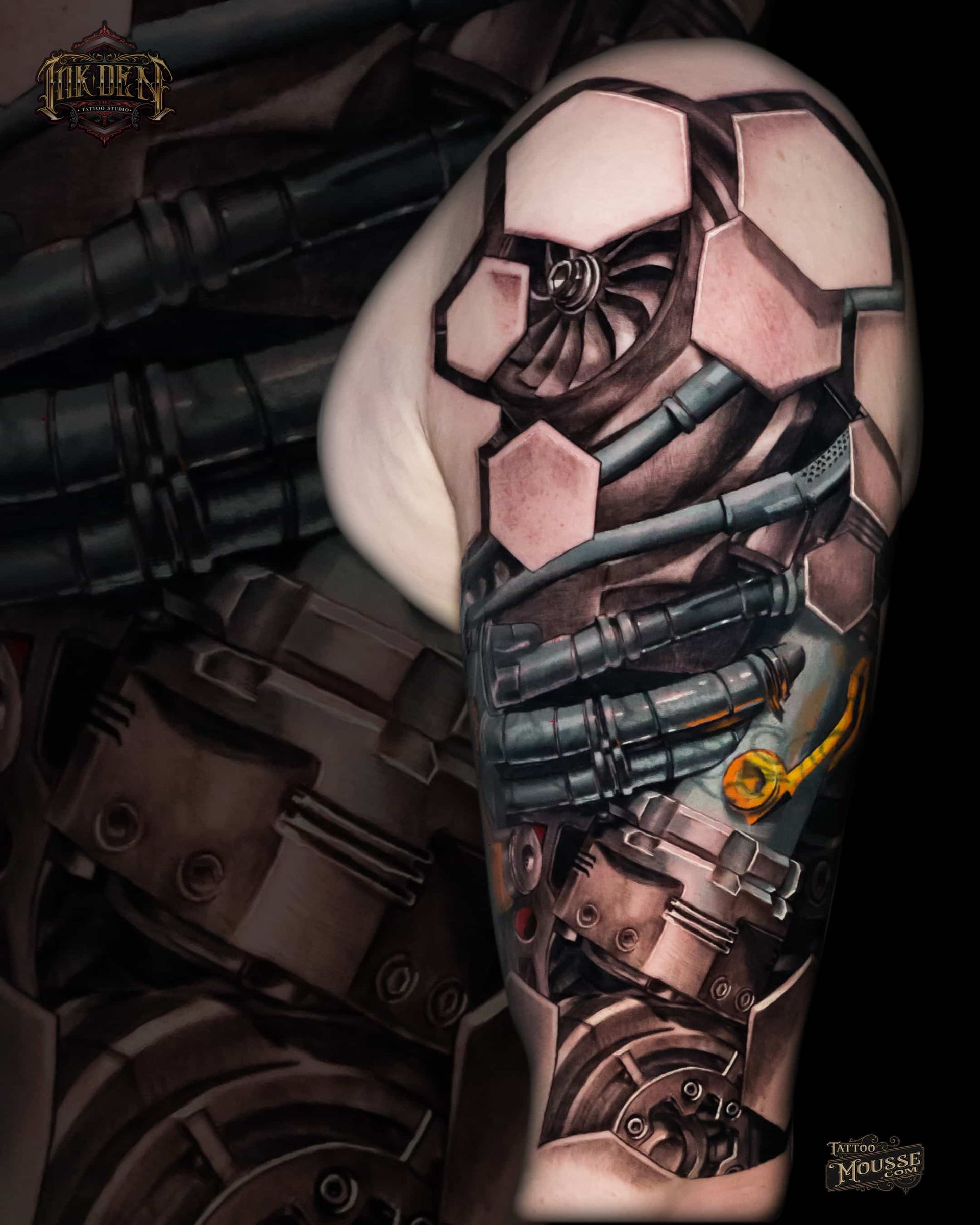 Close-up of a cybernetic arm with pink hexagonal armor and exposed mechanical components