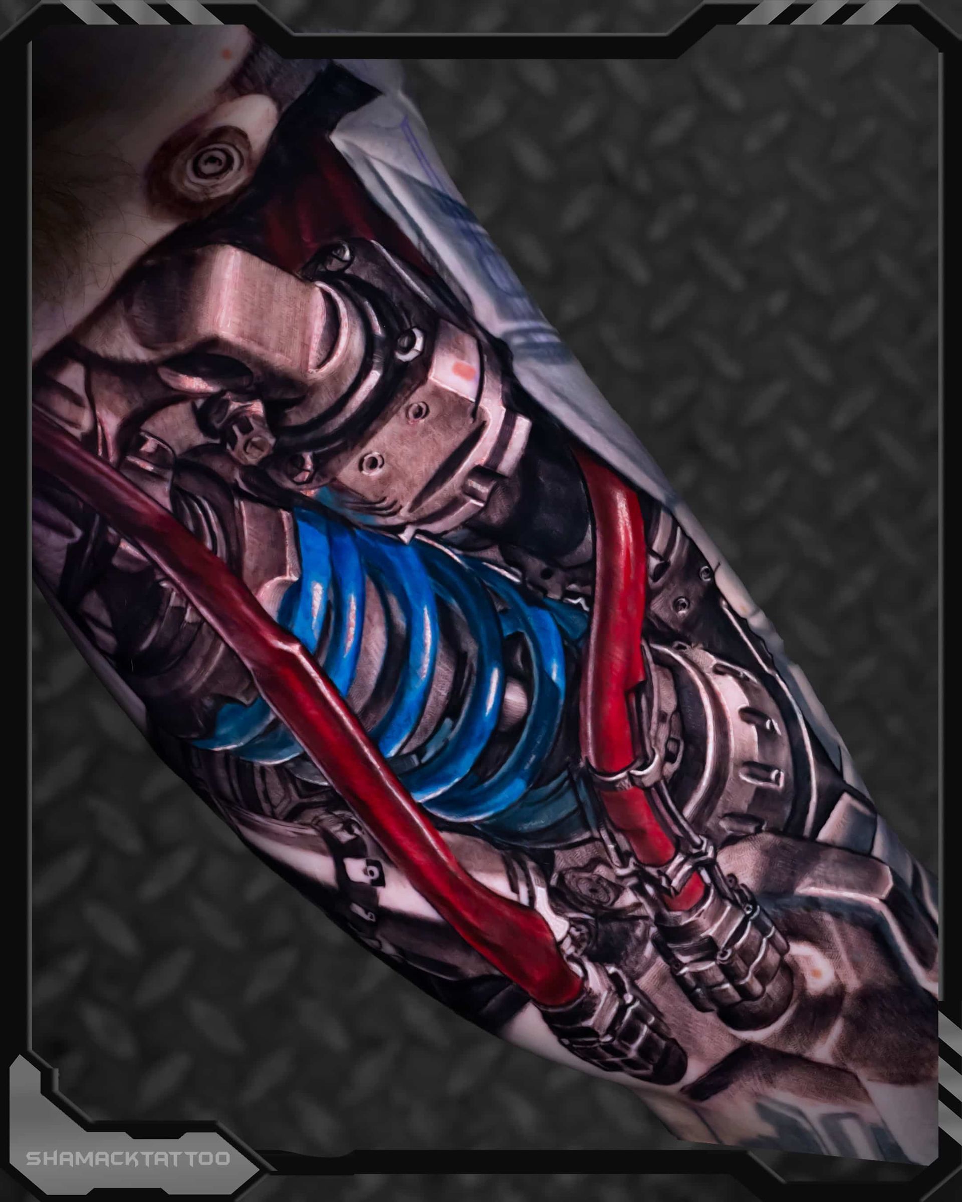 Close-up of a metallic robotic arm with red tubing and a glowing blue coil on a dark textured background