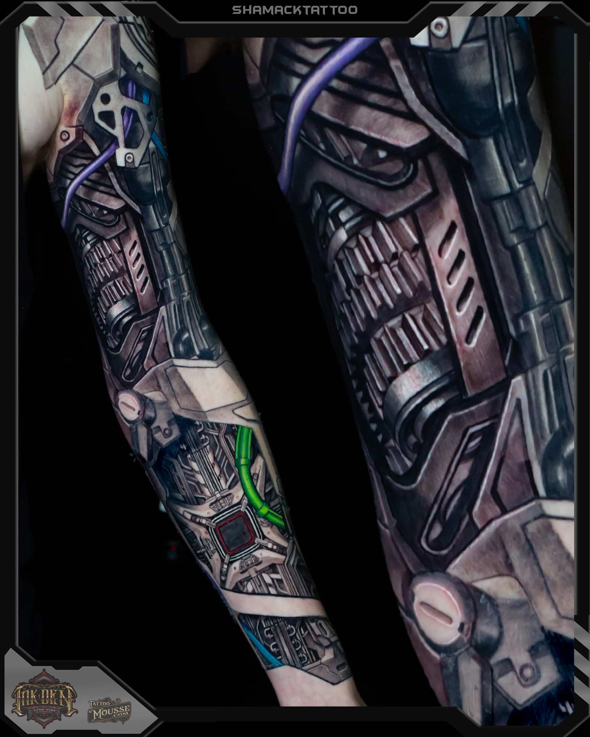 Close-up of two tattooed forearms with intricate biomechanical black and gray ink designs, one with green accent