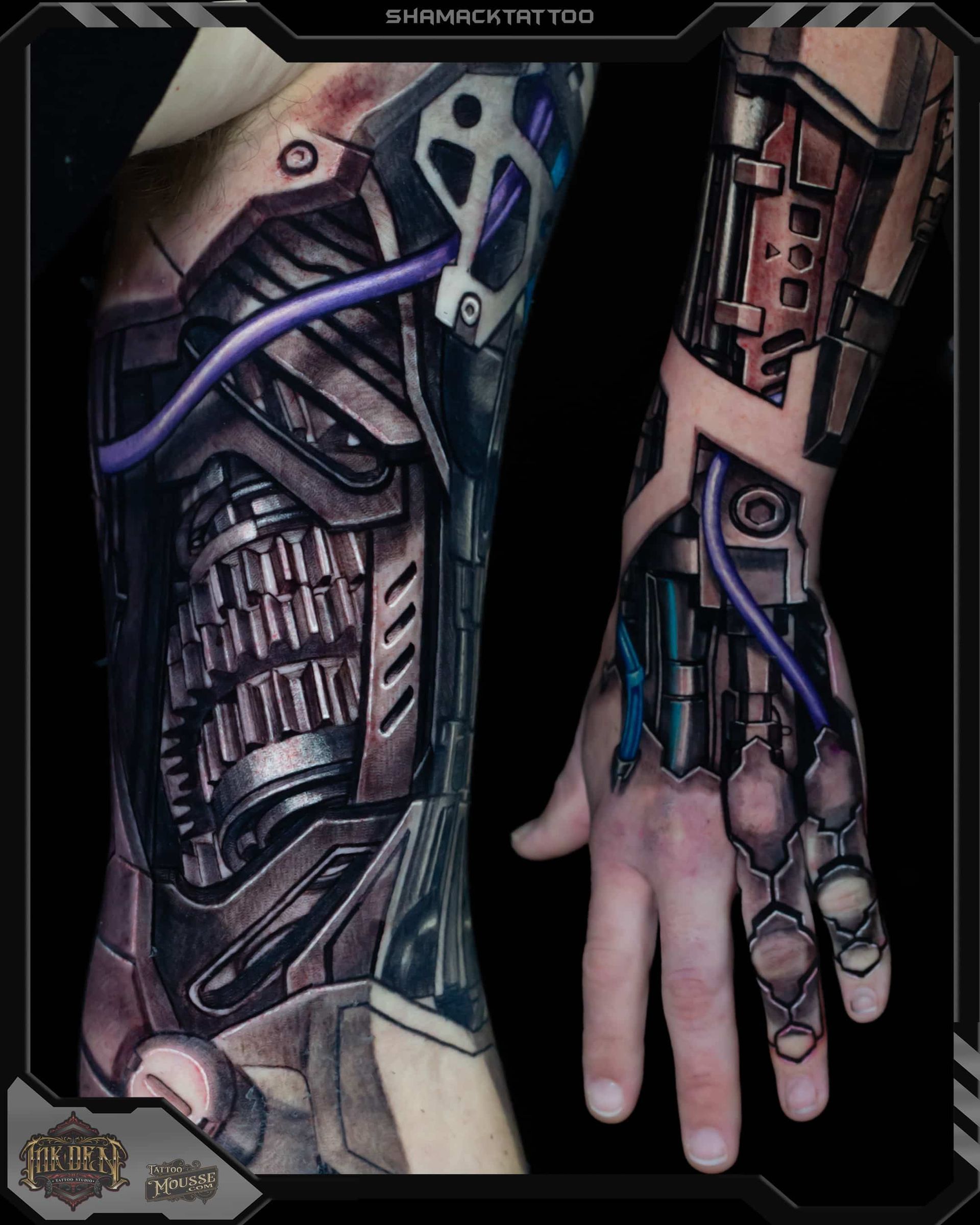 Cyberpunk-style tattooed forearm and hand with exposed mechanical implants, blue tubing, and metal plating