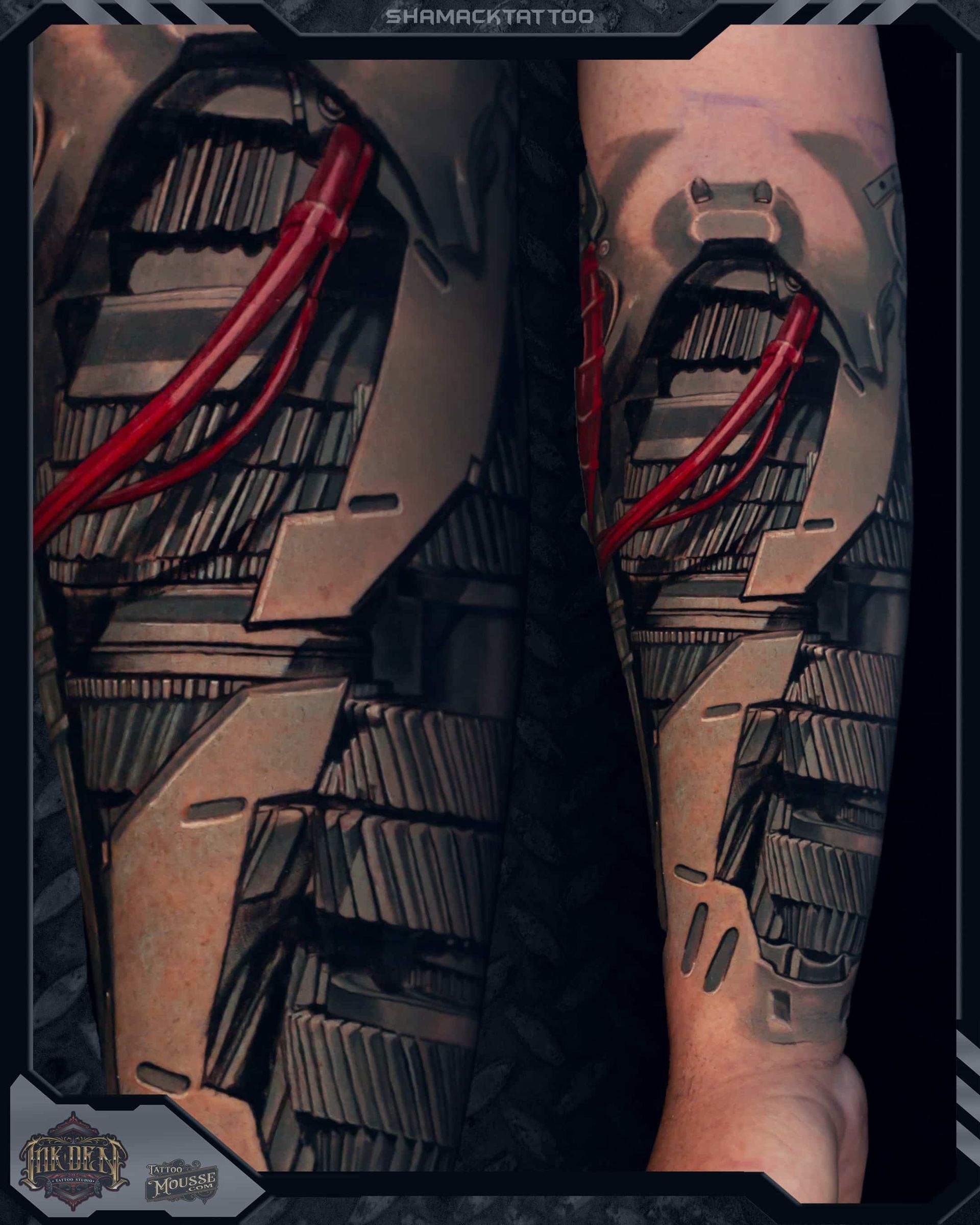 Close-up of a futuristic armored leg with red cables and tan metal plating.
