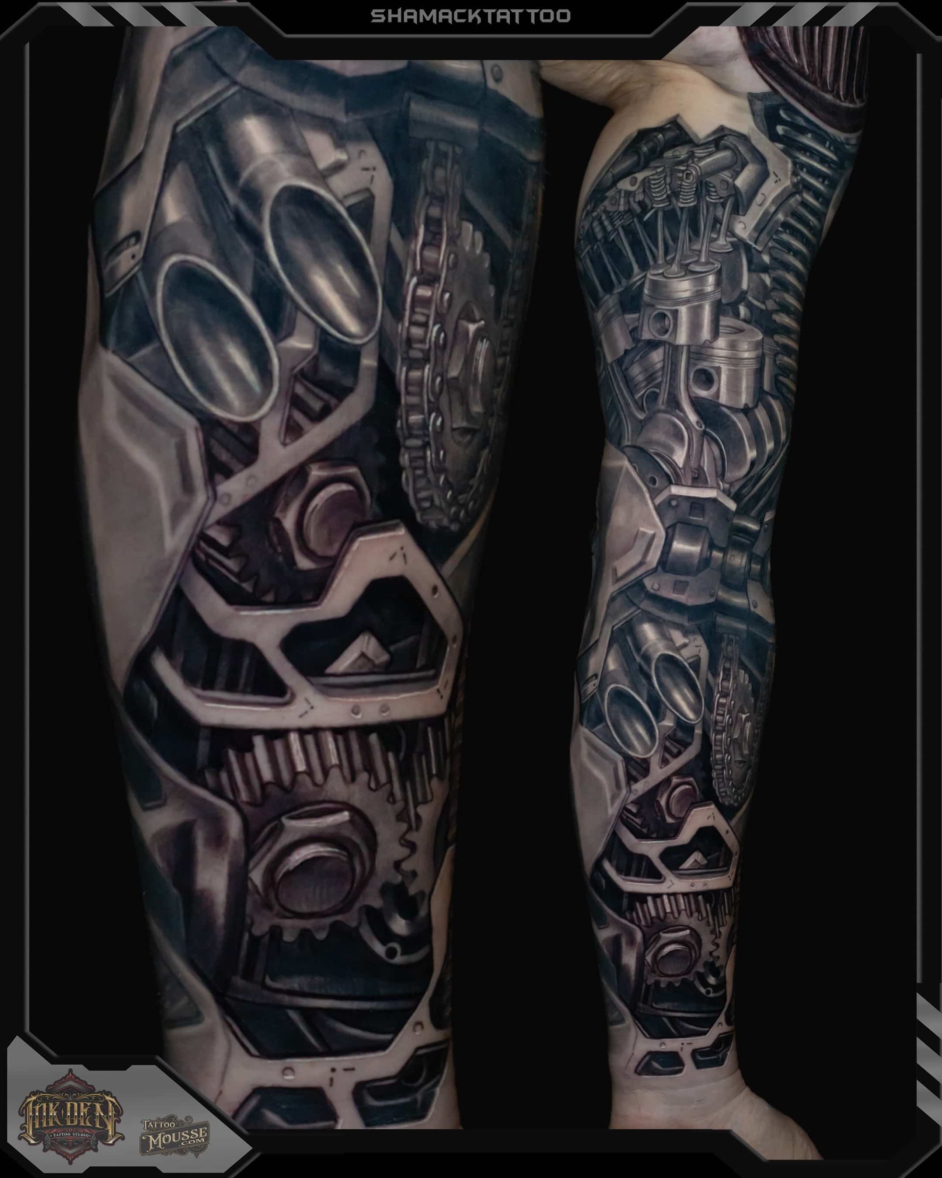 Two tattooed arms with intricate black-and-gray biomechanical sleeve tattoos on a dark background