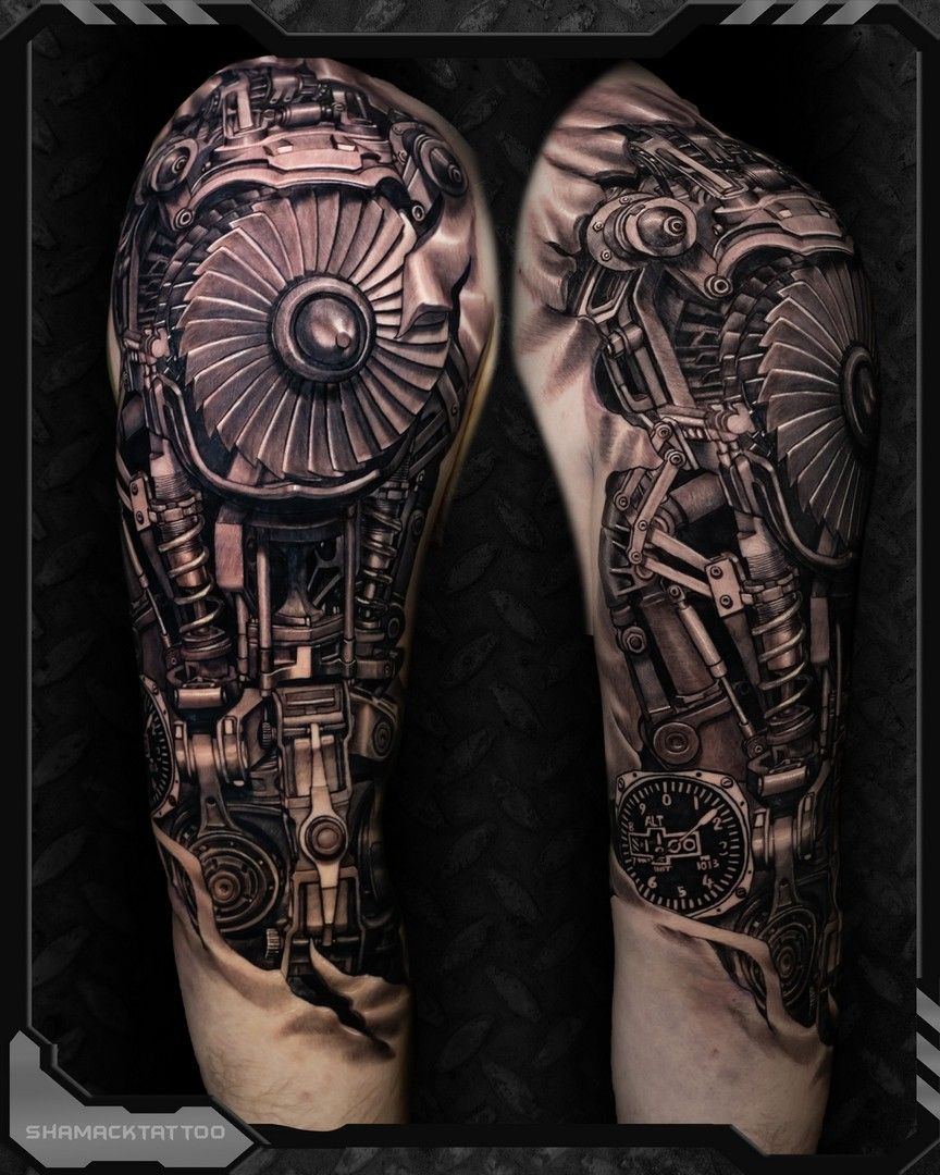 Black-and-gray biomechanical tattoo sleeves on two forearms, featuring gears, pipes, and mechanical details