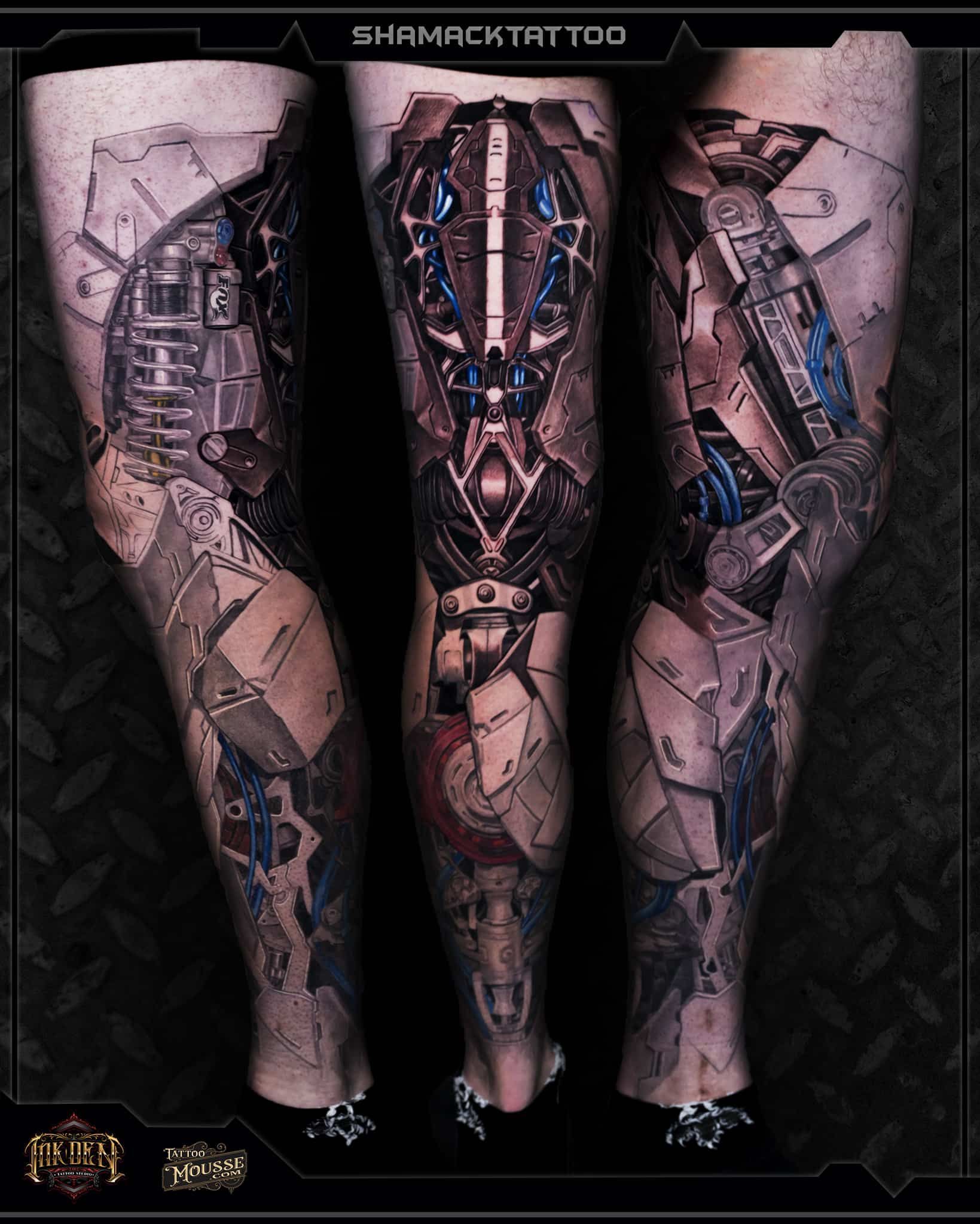 Three tattooed legs with cyberpunk-style mechanical designs on a dark textured background