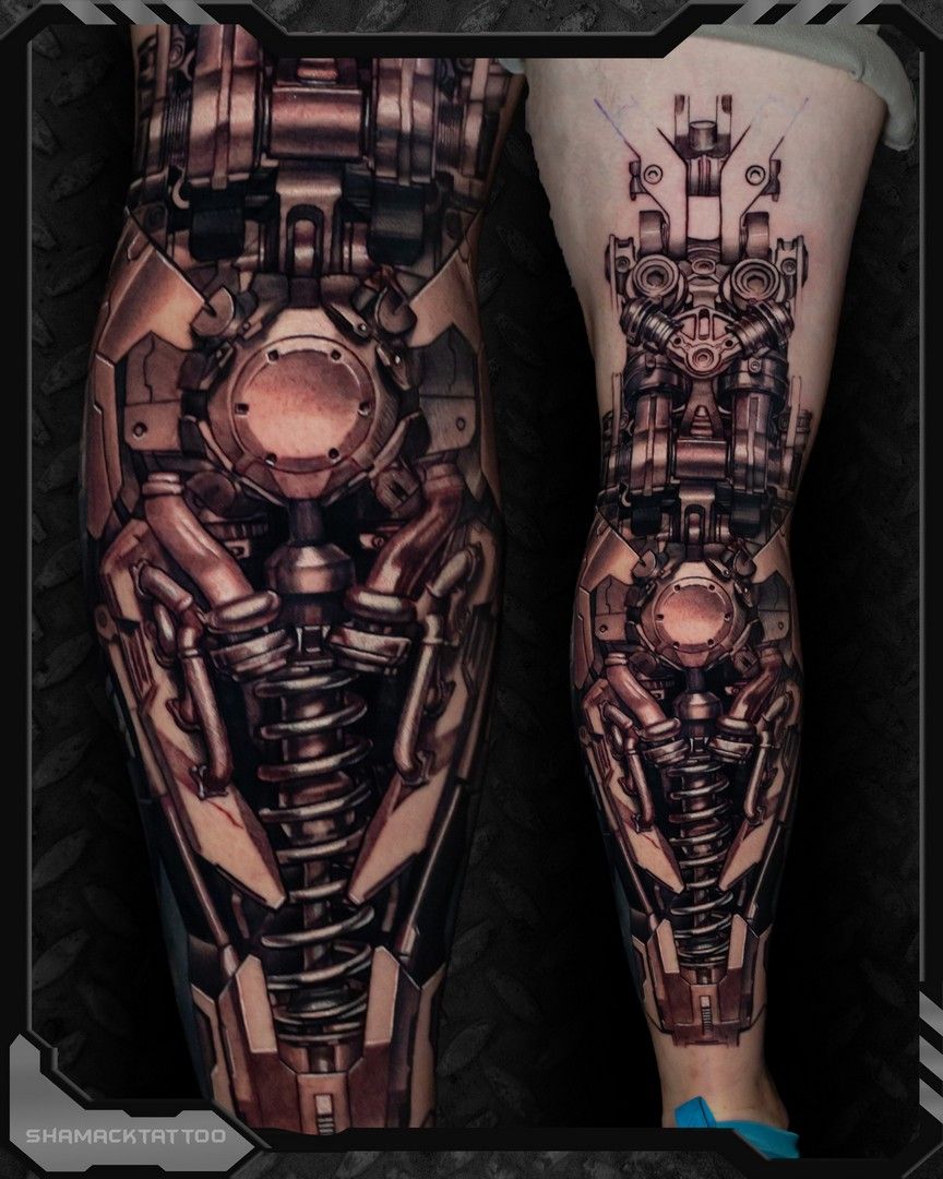 Full-leg biomechanical tattoo art in copper and black, featuring mechanical gears, tubes, and a central core design.