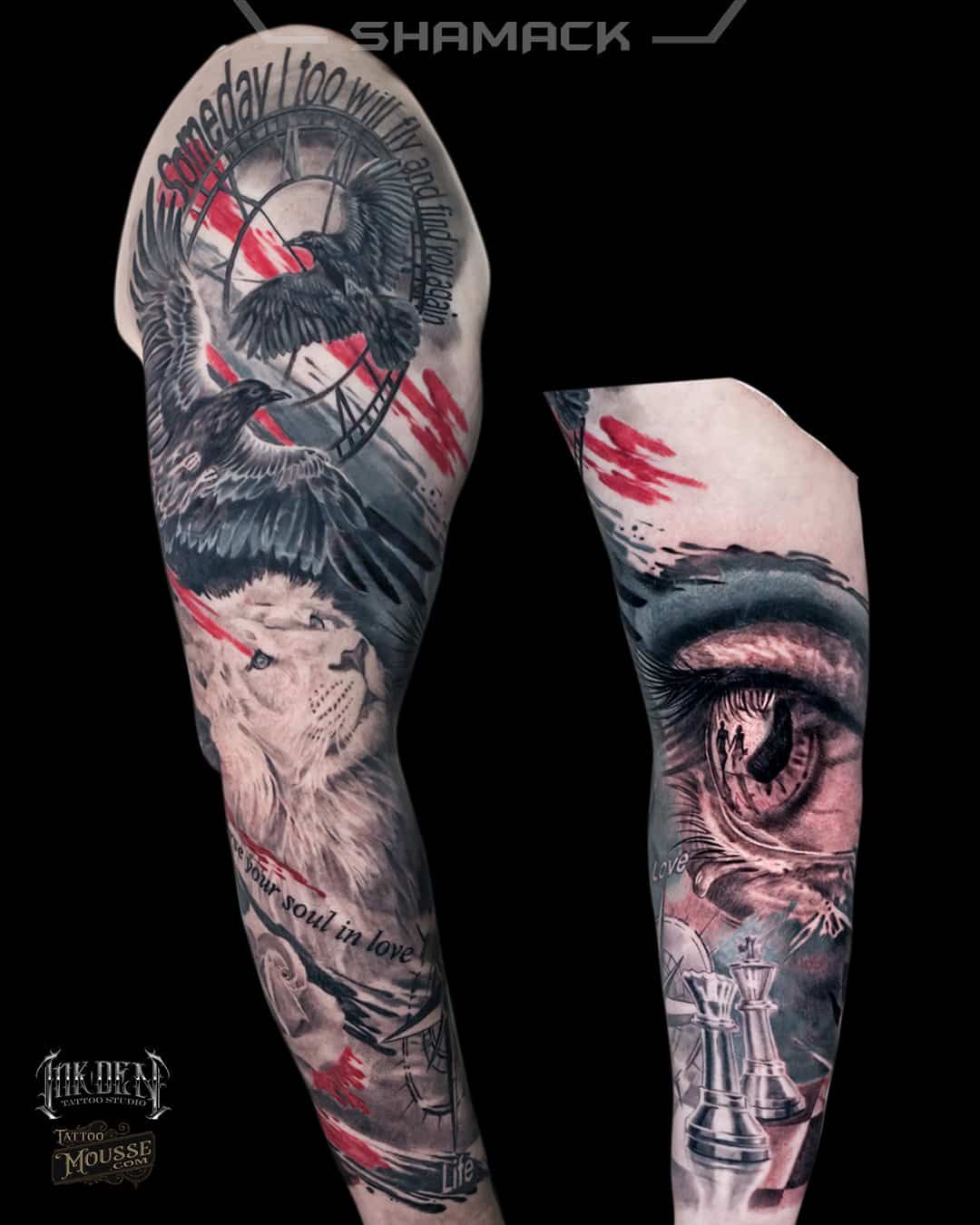 Tattooed forearm showing surreal black-and-red eye and face designs on a black background