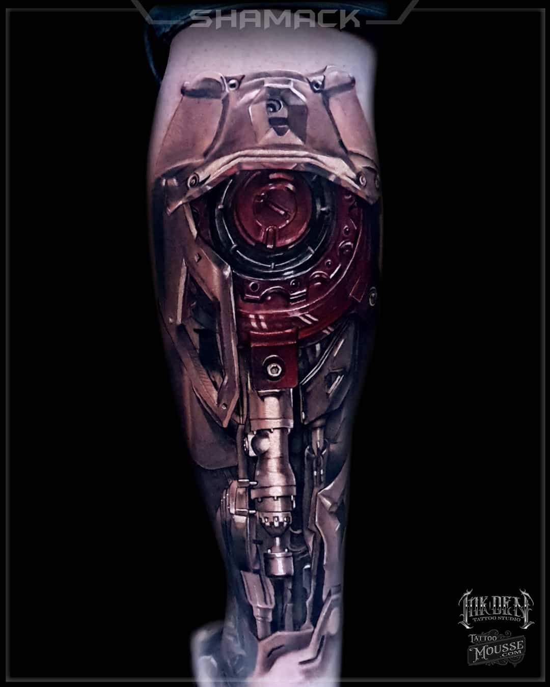 Futuristic robotic arm with a glowing red central lens on a dark background.