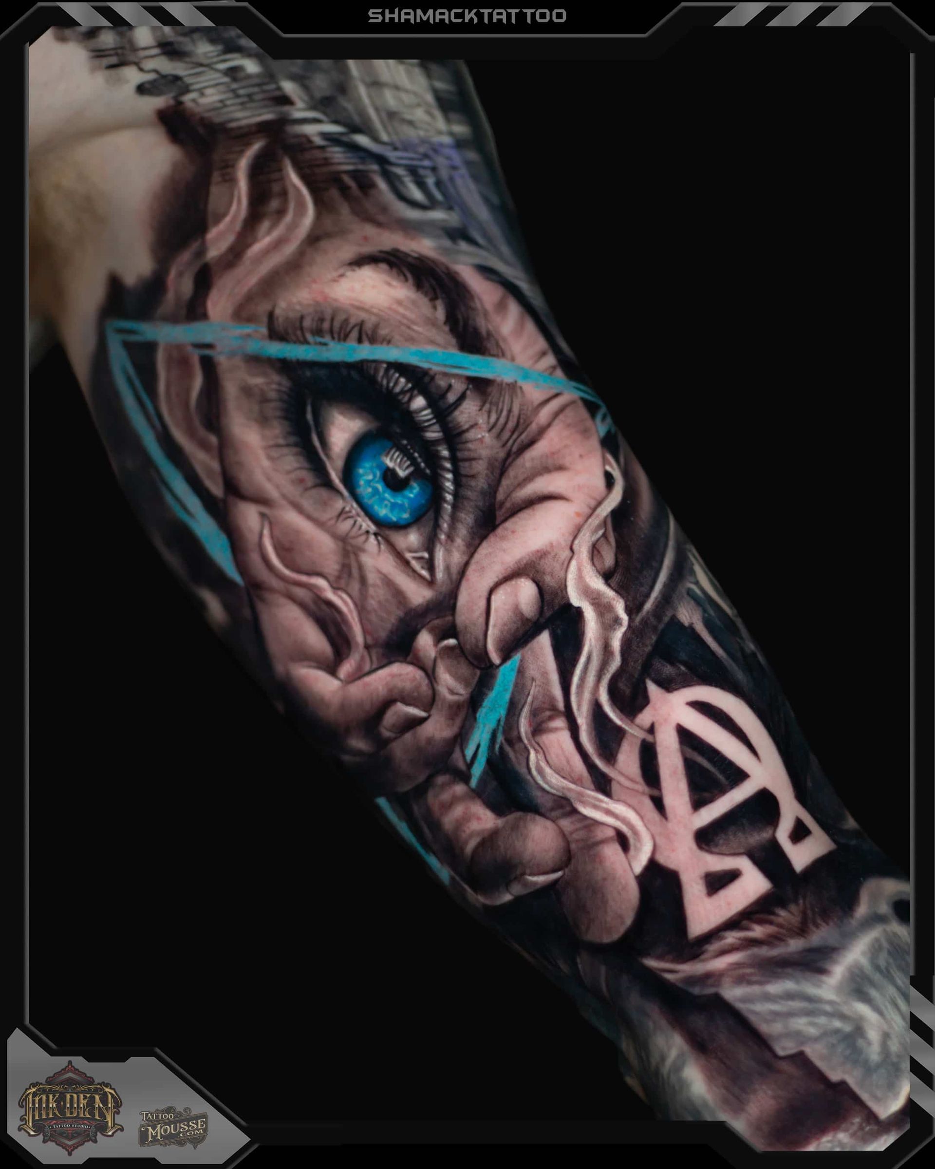 Tattooed forearm with a vivid blue eye and teal lightning-like streaks on a black background
