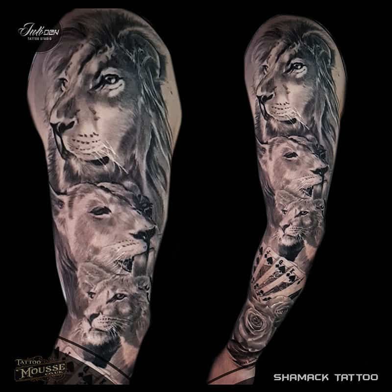 Two tattoo designs on forearms: a lion portrait, lion cub, and roses in black and gray.
