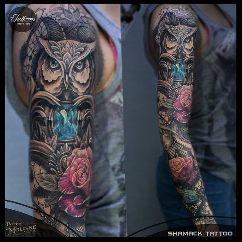 Two views of a tattooed arm with an owl, roses, and blue floral sleeve art