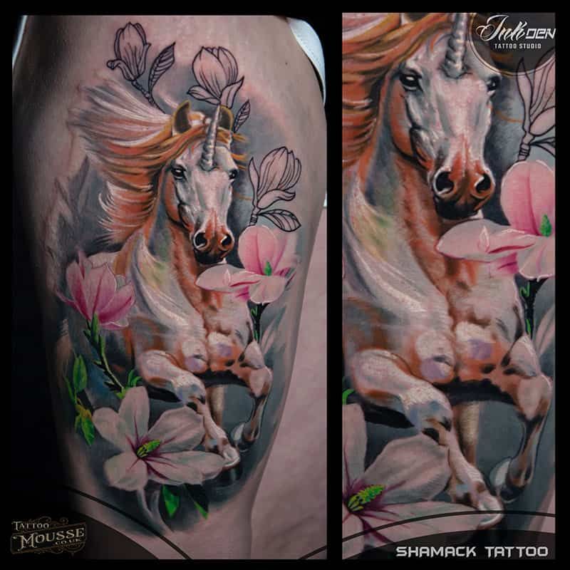 Colorful horse tattoo on a calf with pink flowers and flowing mane, shown in two close-up views