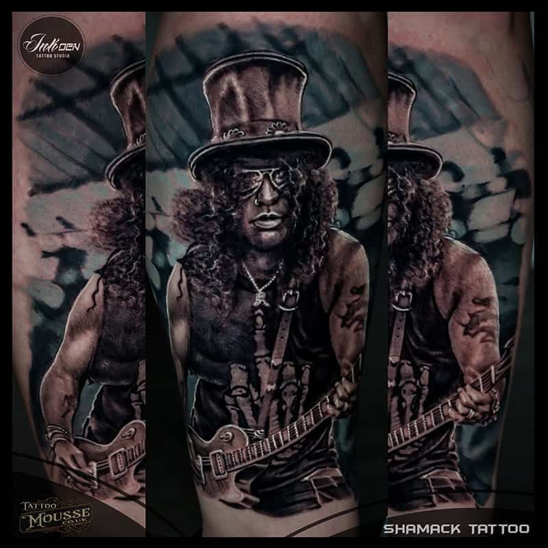 Tattoo design collage of a top-hat musician playing guitar, in dark muted tones
