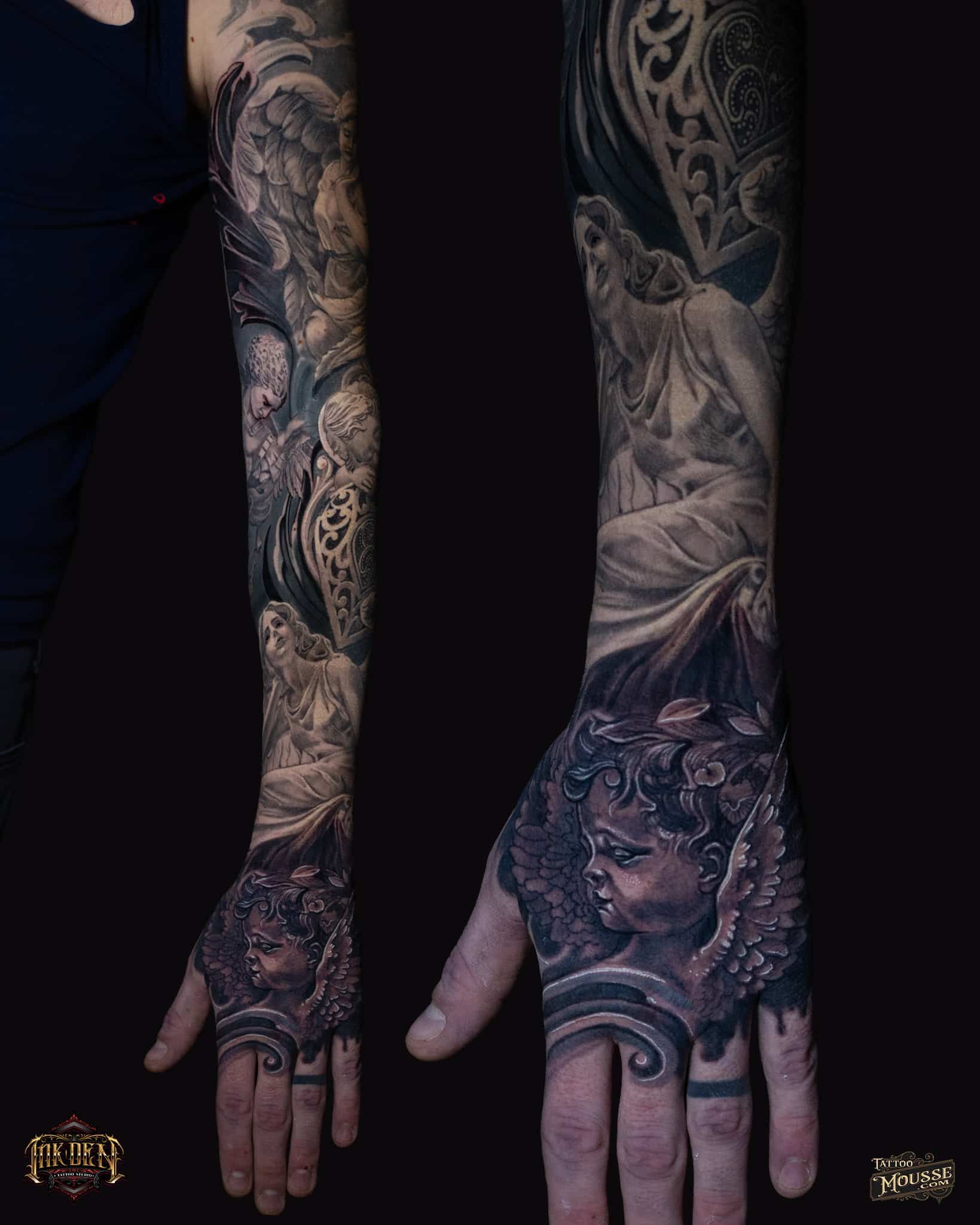 Tattooed forearms and hands displayed against a dark background, showing detailed black-and-gray sleeve tattoos.