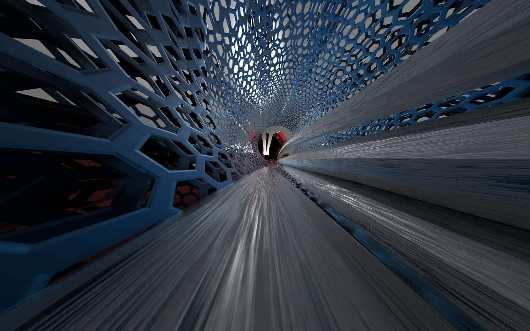 Blurred view down a blue tunnel with a distant red light at the center