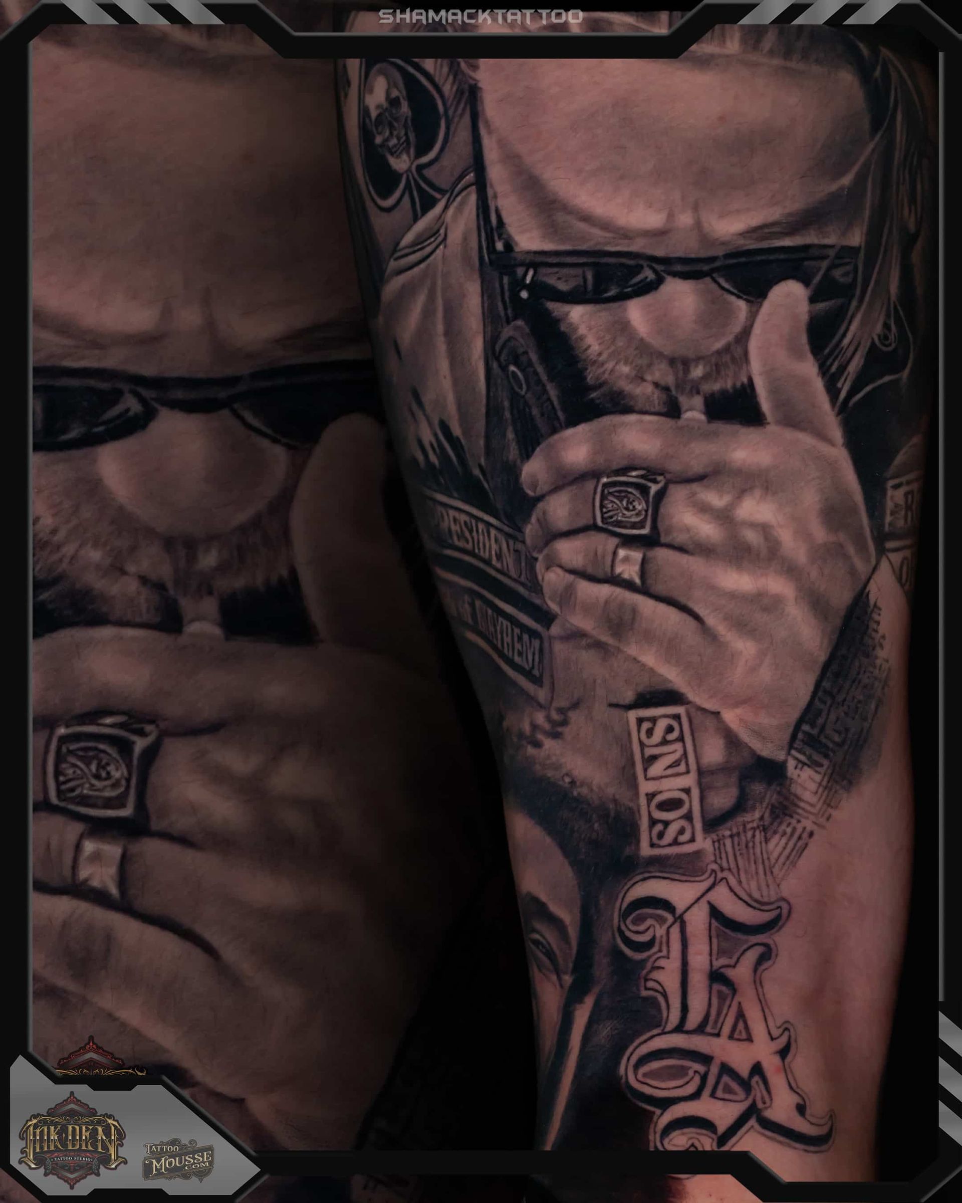 Close-up mirrored portrait of a tattooed man in sunglasses, covering his mouth with his hand.