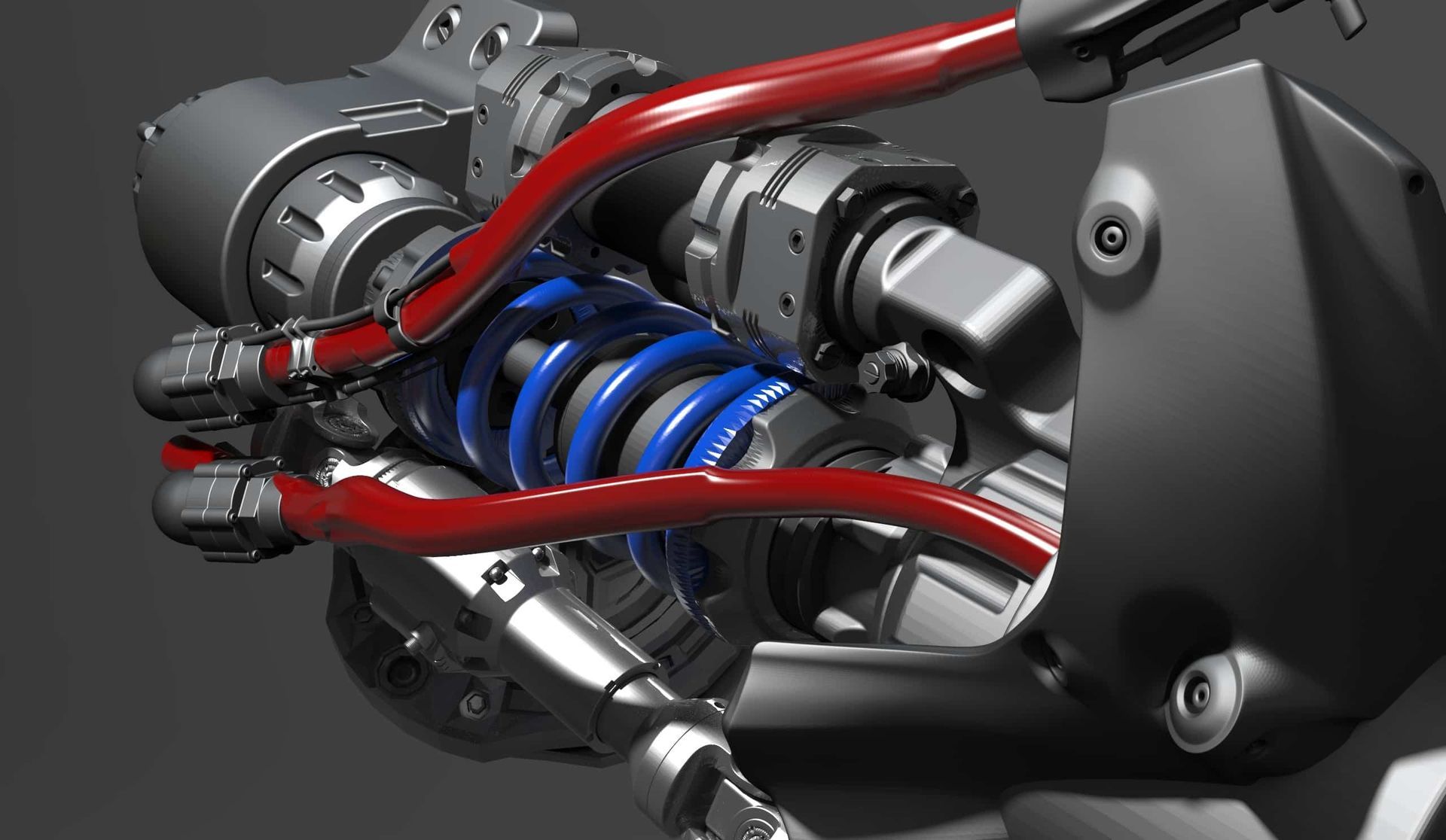 Close-up of a mechanical assembly with blue coil spring, red hoses, and metal components.