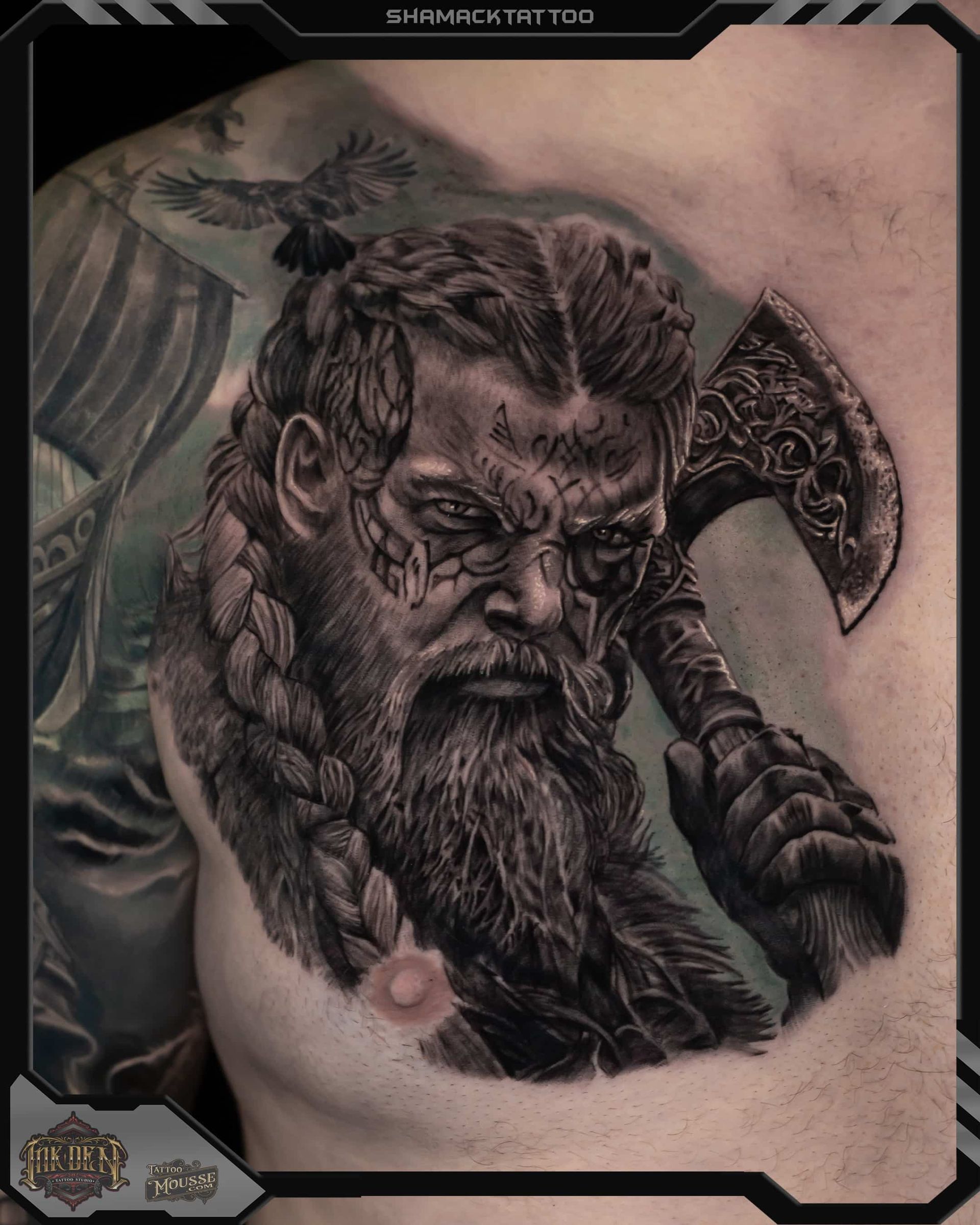 Black-and-gray tattoo portrait of a stern bearded Viking with horned helmet and axe