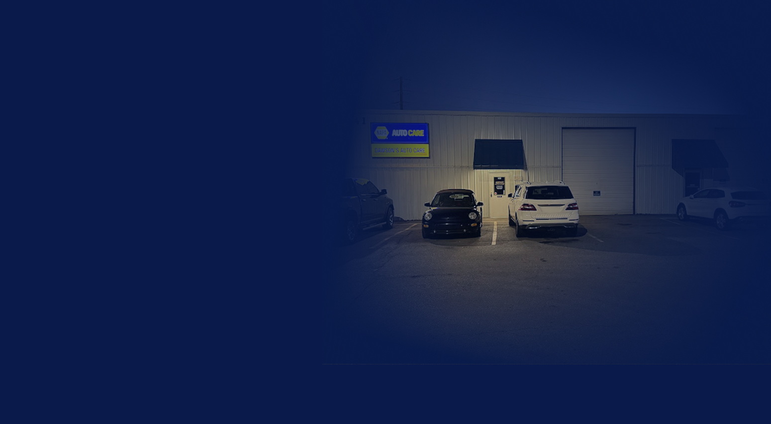 Two cars are parked in front of a building | Dawson's Auto Care