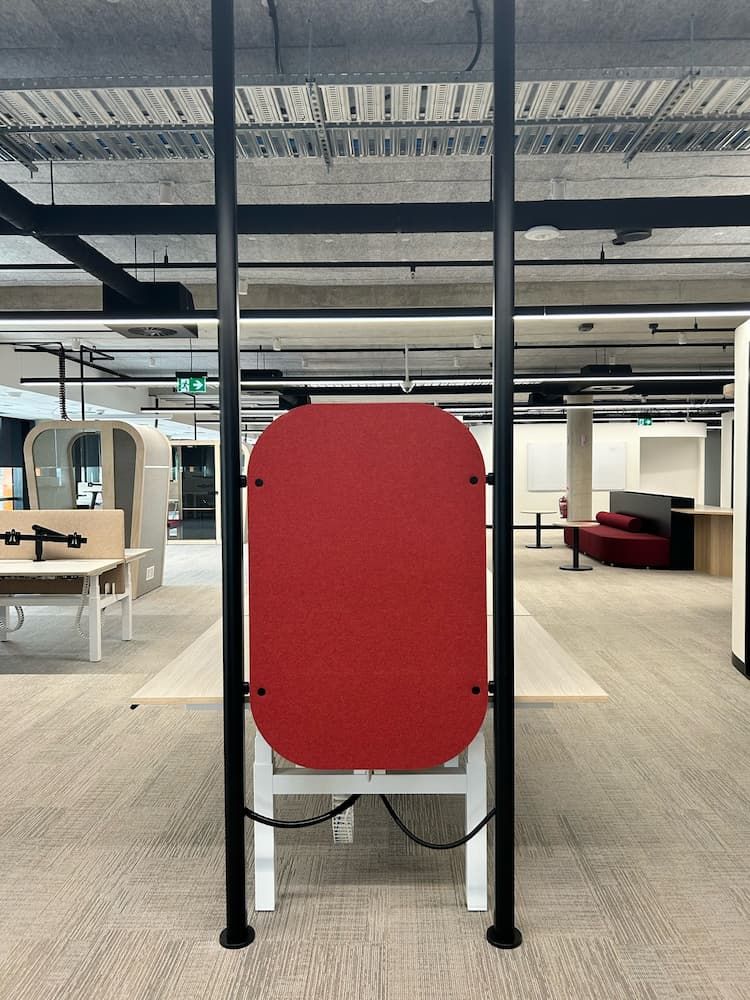 A Large Red Object is Hanging From a Pole in a Room — PKJ Designs in Thirroul, NSW