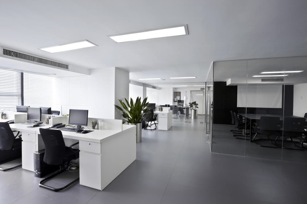 A Large Empty Office With a Lot of Desks and Chairs — PKJ Designs in Thirroul, NSW