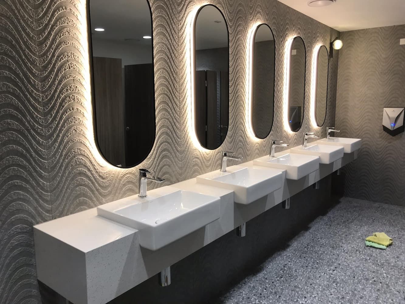 A Bathroom With a Row of Sinks and Mirrors — PKJ Designs in Nowra, NSW