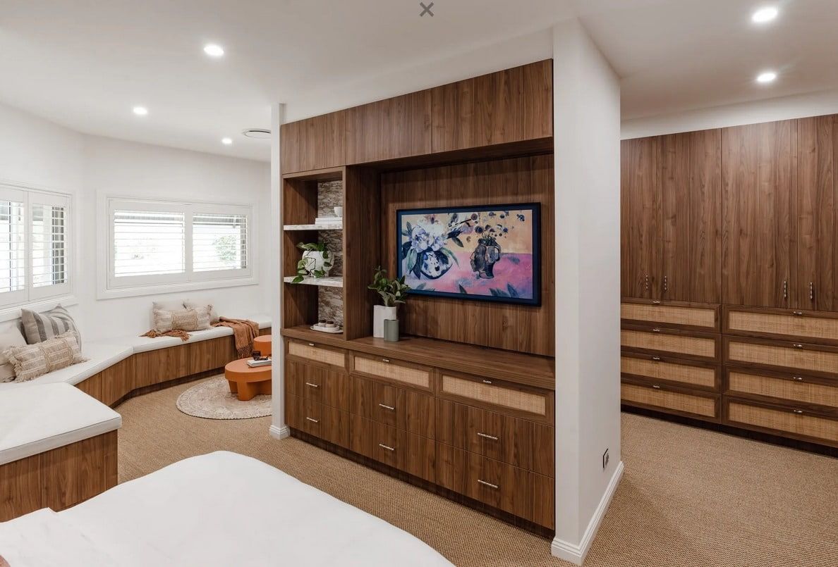 A Bedroom With a Flat Screen Tv Mounted on the Wall — PKJ Designs in Unanderra, NSW