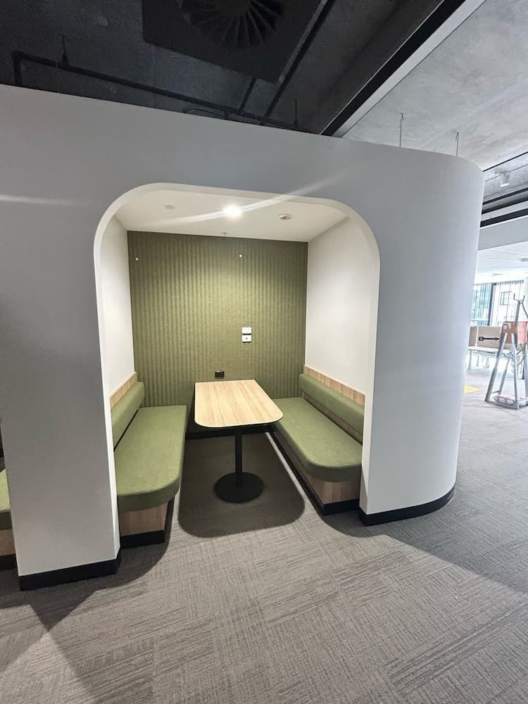 A Small Room With a Table and Benches in It — PKJ Designs in Unanderra, NSW