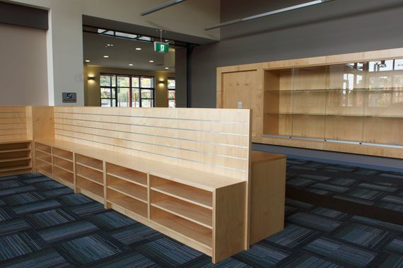 A Room With a Lot of Shelves and a Carpeted Floor — PKJ Designs in Unanderra, NSW