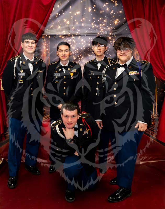 Five people in military dress uniforms pose in front of a red curtain and a sparkling, dark background.
