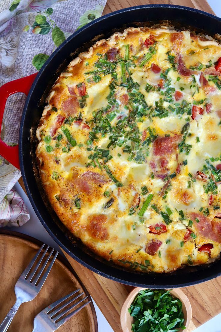A close up of a pizza in a skillet on a table.