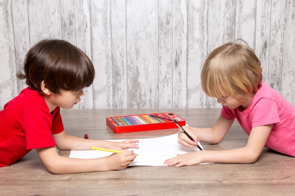 2 kids playing crossword