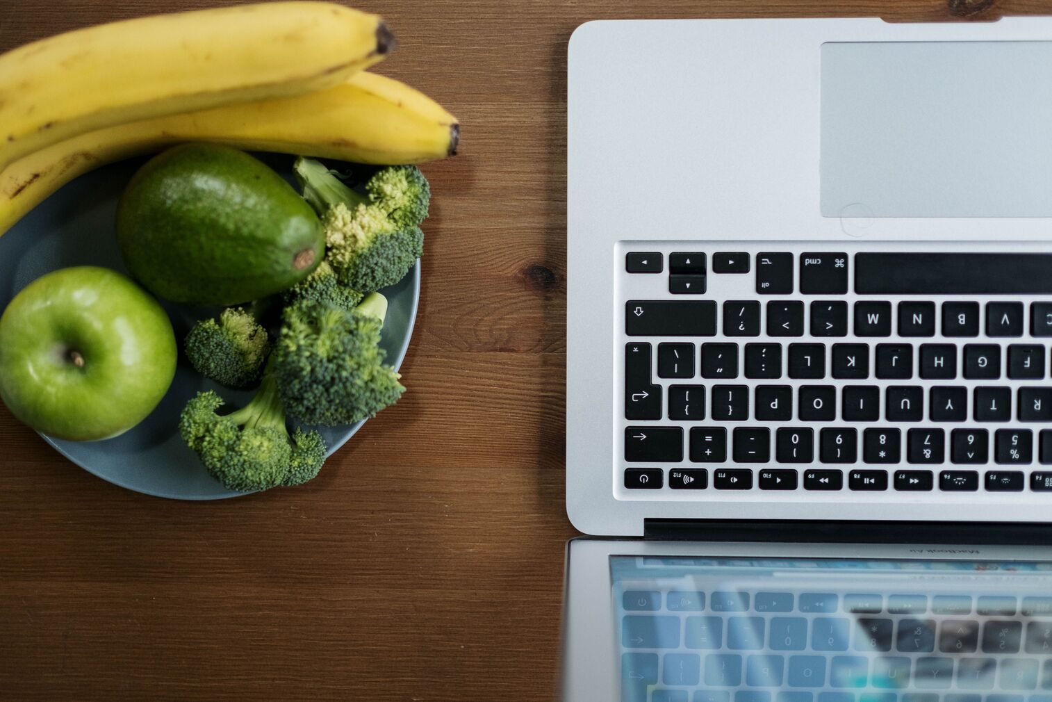 laptop and fruits prepared after nutrition counseling client in Austin