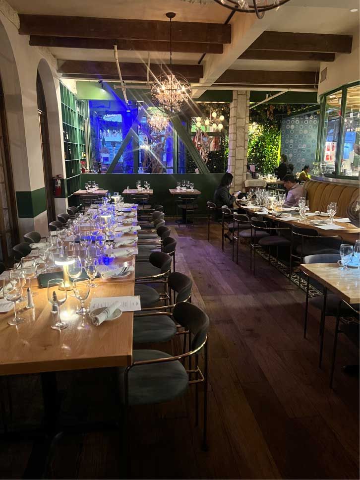 Setting tables for a group event at Allegro Restauraurant in San Diego. 