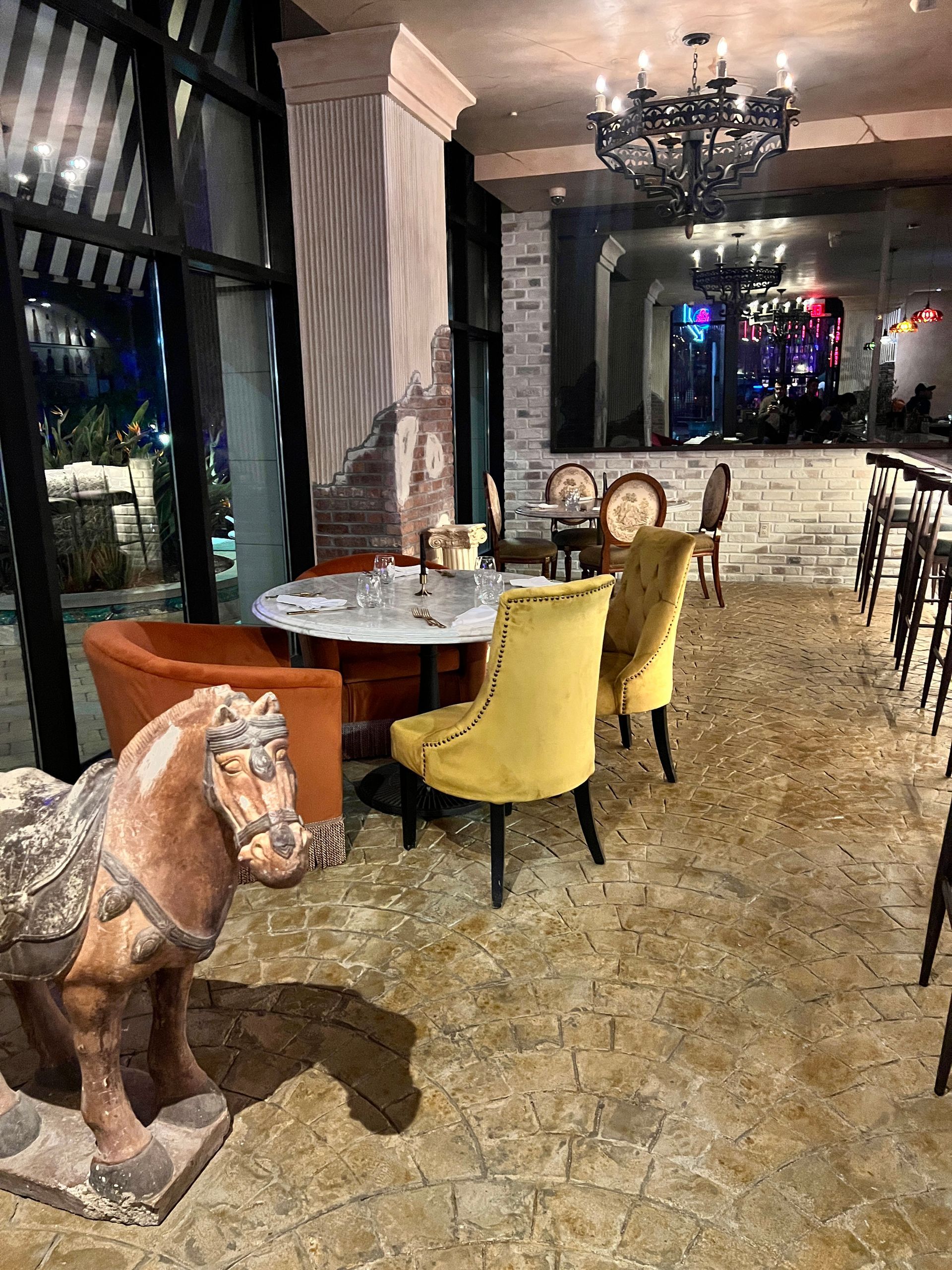 There is a statue of a horse in the middle of the room.