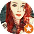 A woman with red hair is in a circle with a star.