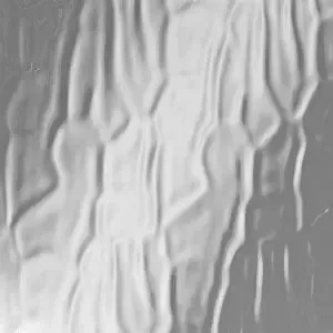 A close up of a piece of glass with a gray texture.