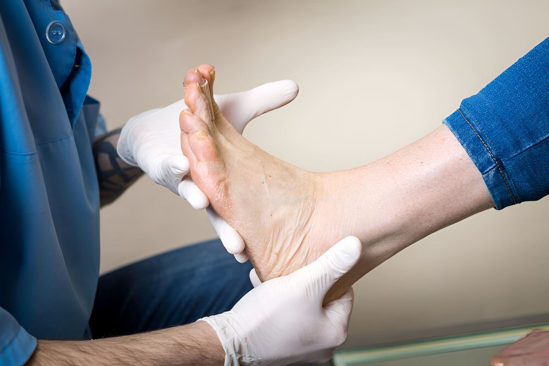 A Person Is Getting Their Foot Examined By A Doctor — Hastings Podiatry Centre In Port Macquarie, NSW