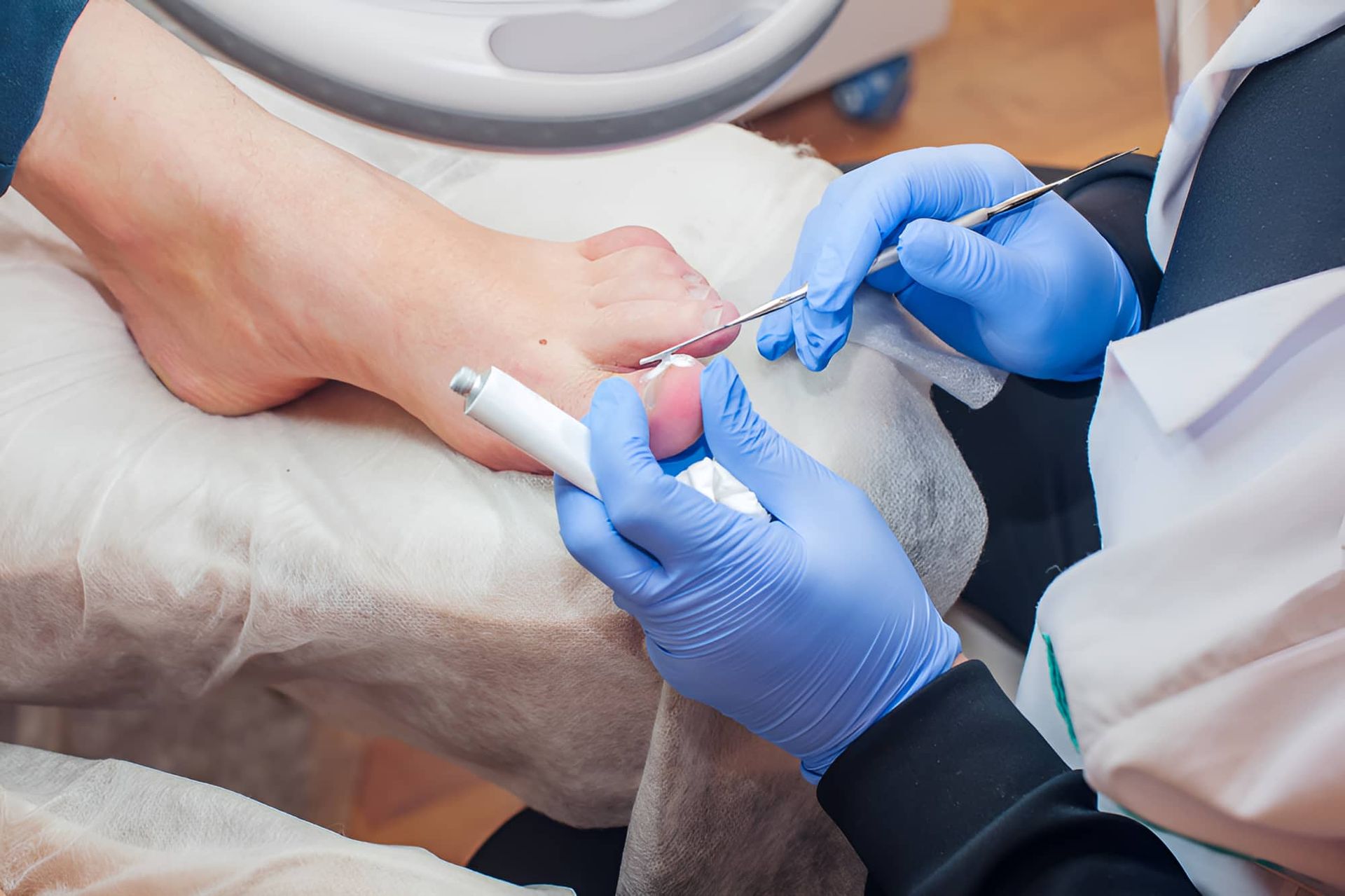 A Person Is Getting Their Nails Done By A Nail Technician — Hastings Podiatry Centre In Port Macquarie, NSW