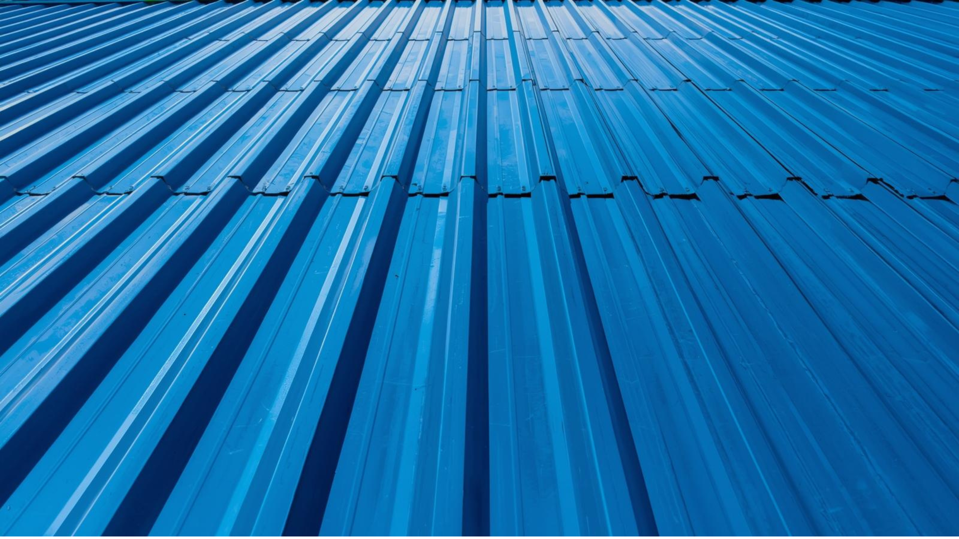 Close-up of blue Colorbond roofing panels with raised ribs. Close-up of blue Colorbond roofing panels with raised ribs.