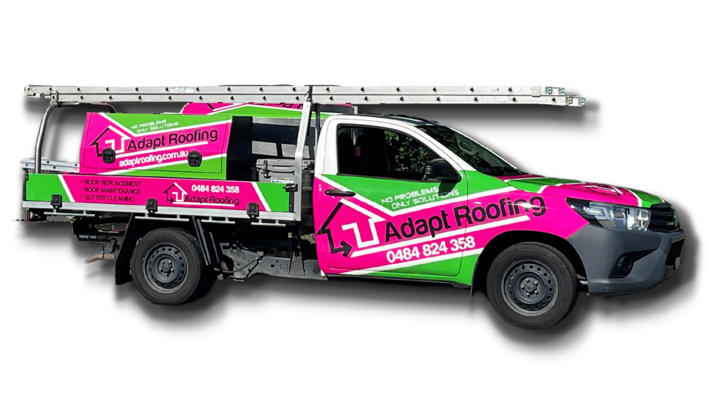 A white pickup truck with bright pink and green branding for