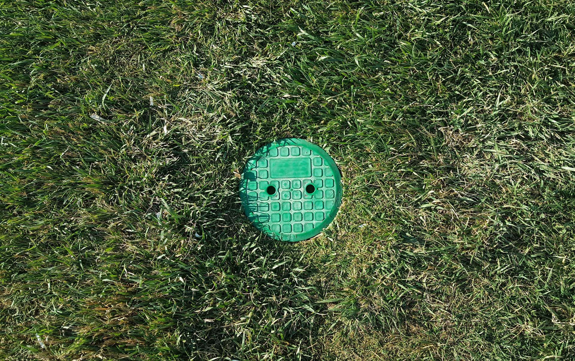 septic tank lid in yard