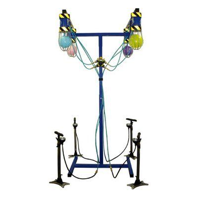 A colorful game apparatus with blue framework, air hoses, and balloons, likely for a contest or activity.