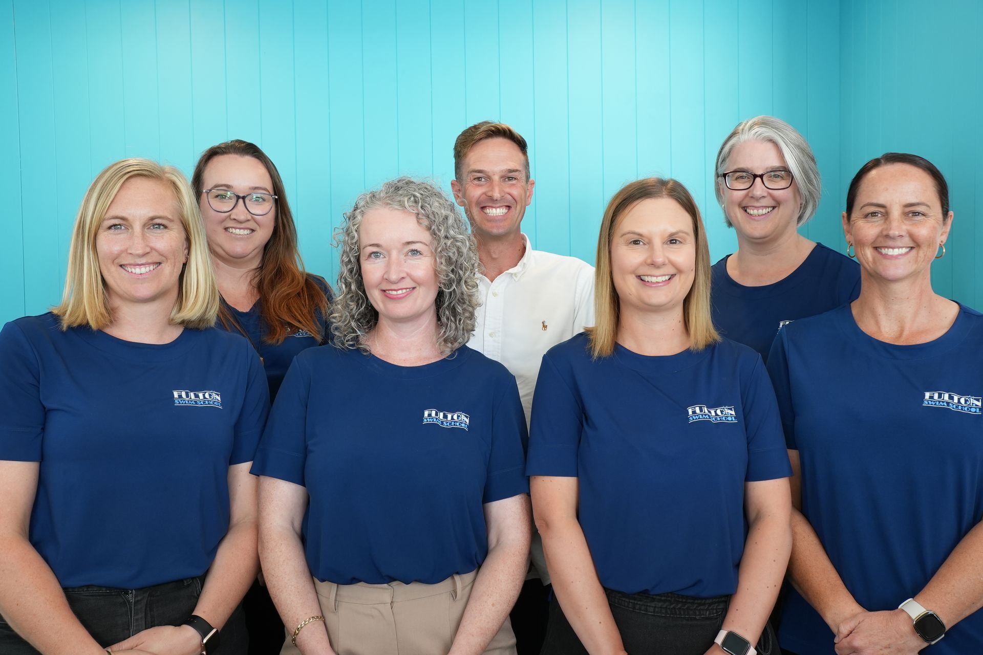 The fulton swim school support office team poses for a photo