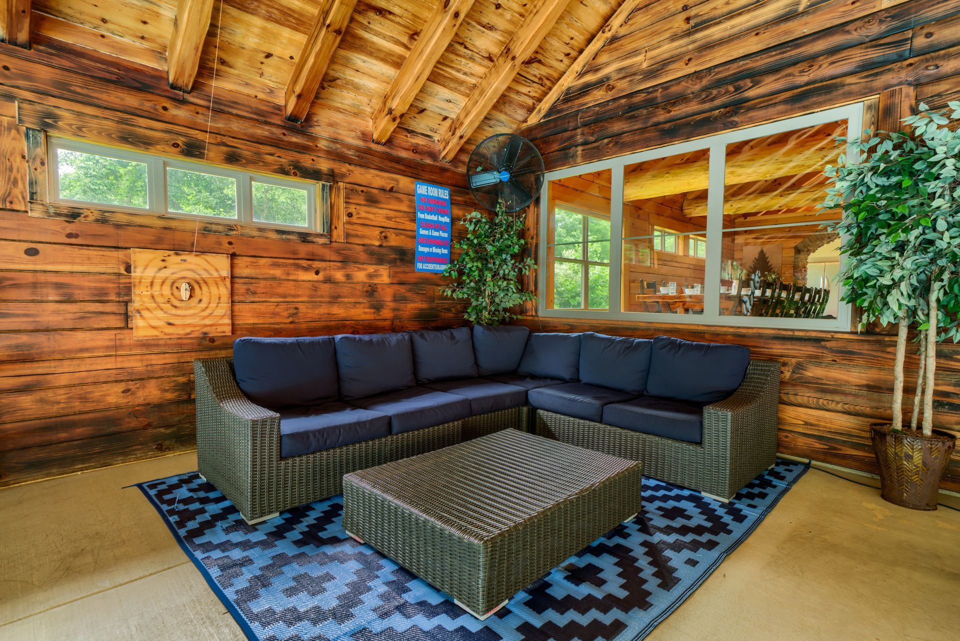 a living room with a sectional couch and a coffee table .