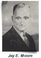 Black-and-white portrait of Jay E. Moore in a suit and tie, with his name printed below.