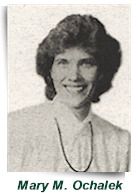 Portrait of Mary M. Ochalek, smiling in a black-and-white headshot