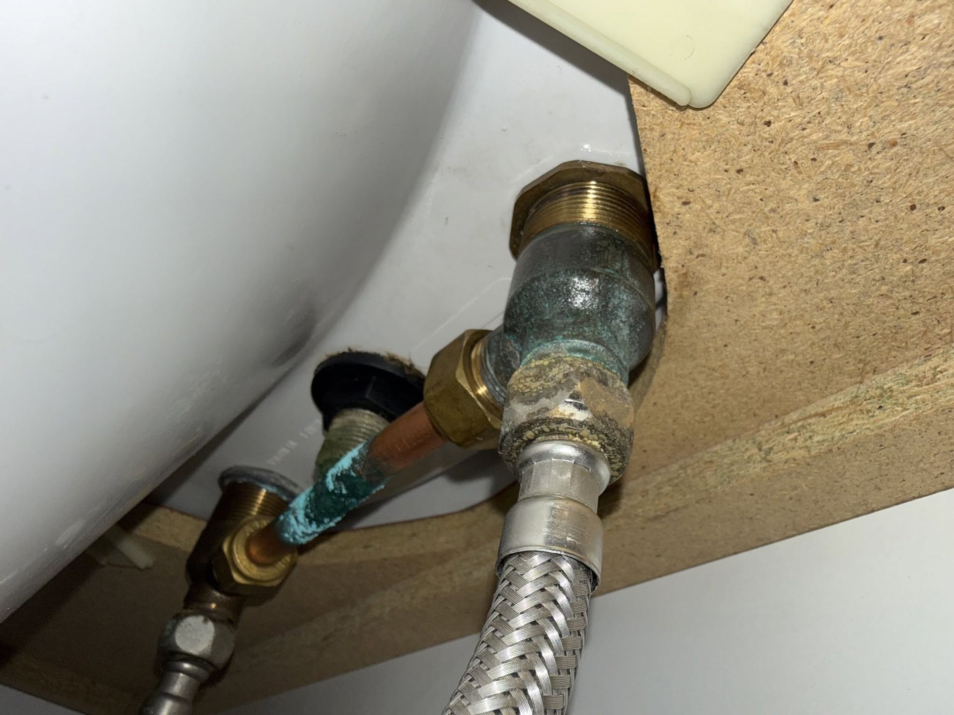 Under-sink Plumbing With Corroded Brass Valves and a Flexible Metal Supply — Kerney Plumbing in Bacchus Marsh, VIC