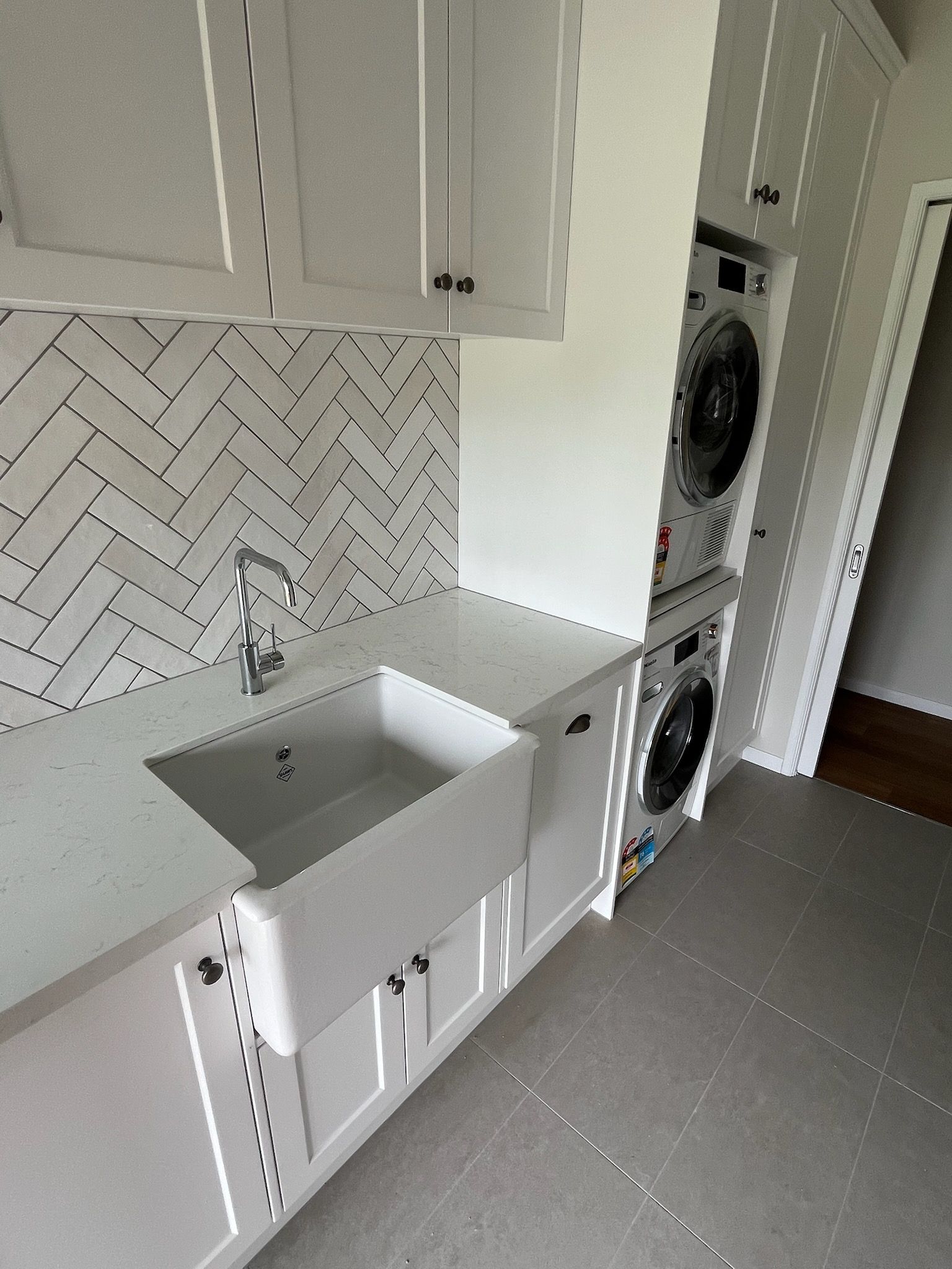 A Laundry Room With a Washer, dryer and a Sink — Kerney Plumbing in Bacchus Marsh, VIC